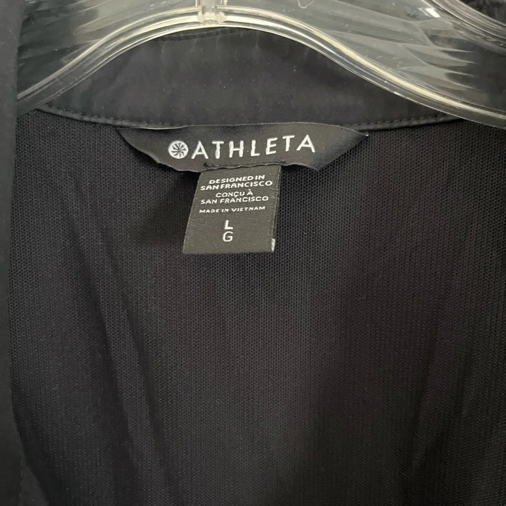 ATHLETA TOPSPIN DRESS BLACK SHORT SLEEVE ZIP
FRONT CINCH 
Size L - Picture 2 of 3